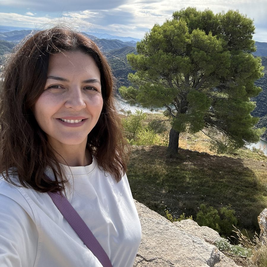 Kateryna Bannikova on a hilltop above a river valley in Spain